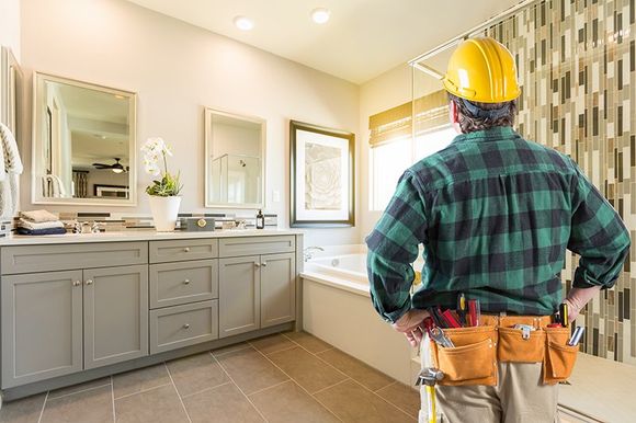 Greenhagen Homes contractor views bathroom remodeling job in Oklahoma home