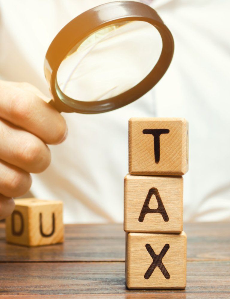 Tax Blocks and Magnifying Glass — Accountants & Bookkeepers in Southern Highlands