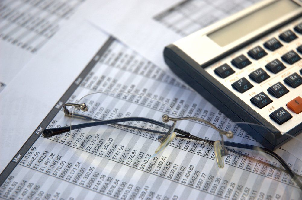 Glasses, Calculator & Financial Documents — Accountants & Bookkeepers in Southern Highlands