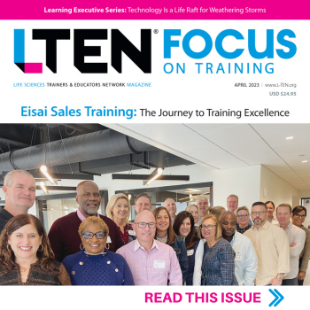 A group of people standing in front of a sign that says lten focus on training