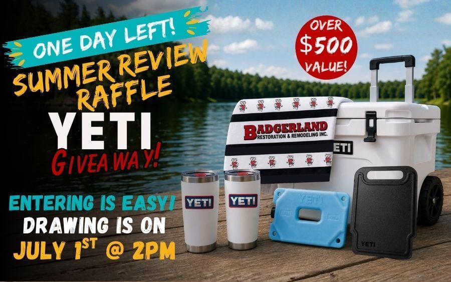 Yeti wheeled cooler, 2 tumblers, an ice pack, a cutting board, and Badgerland Restoration & Remodeling logo beach towel all on a dock with a lake in the background.