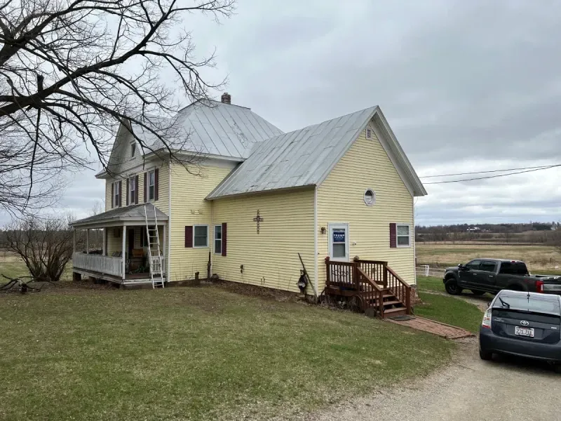 Residential Hail Damage Metal roof and siding replacement by roofing contractor Badgerland Restoration & Remodeling
