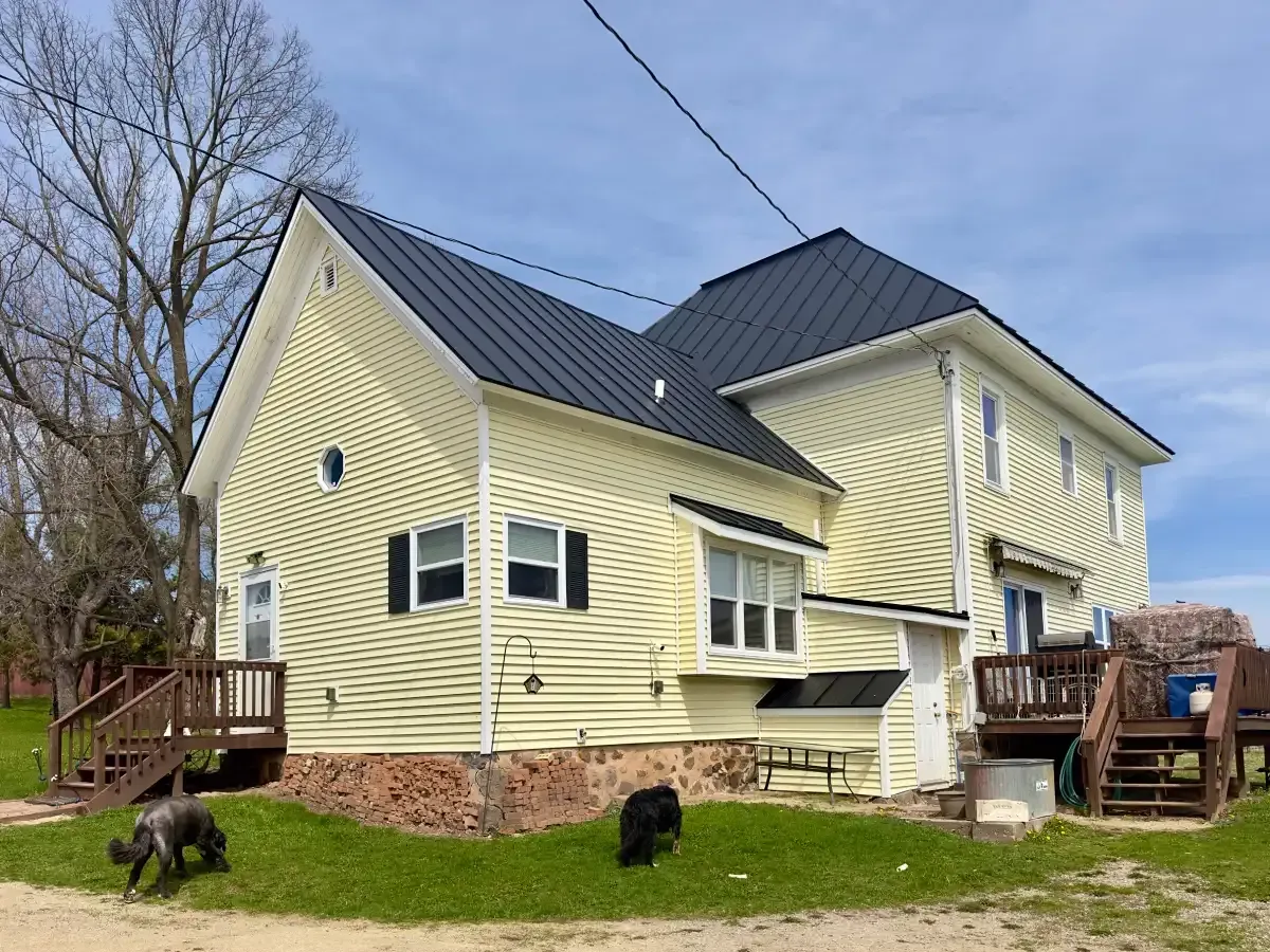 Residential Hail Damage Metal roof and siding replacement by roofing contractor Badgerland Restoration & Remodeling