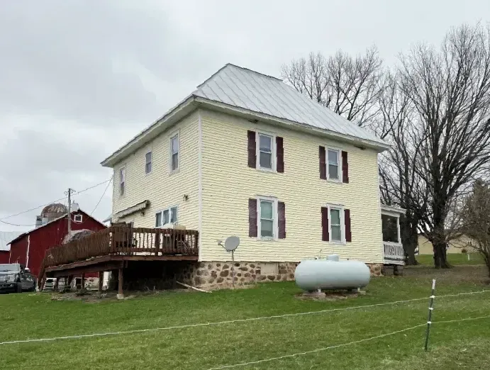 Residential Hail Damage Metal roof and siding replacement by roofing contractor Badgerland Restoration & Remodeling