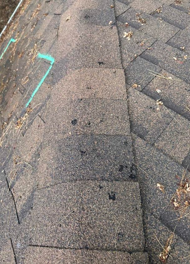 Residential roof replacement New London WI hailstorm damage to shingled roof