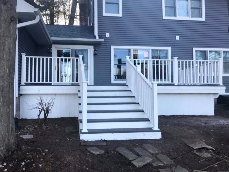 Renew Plastics Deck white composit deck replacement on Chain O’ Lakes — Waupaca, WI — Badgerland Restoration & Remodeling