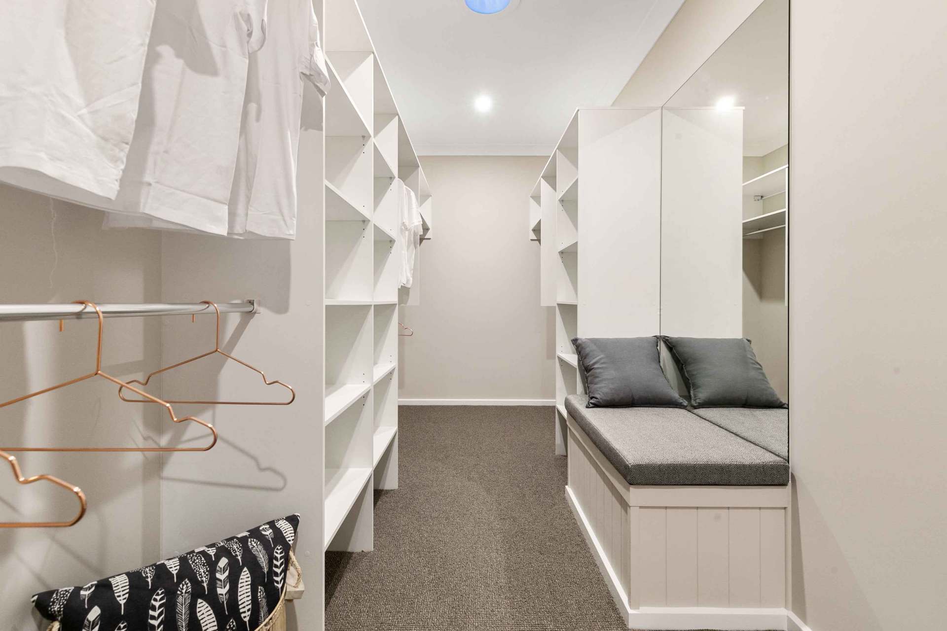 cabinet with pillow and hangers