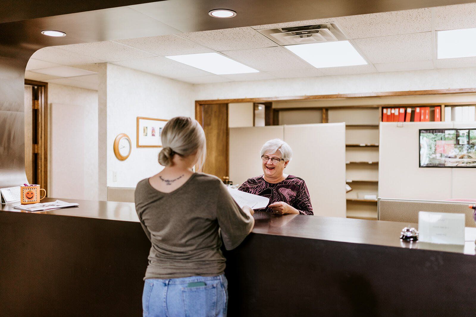 Client handing papers