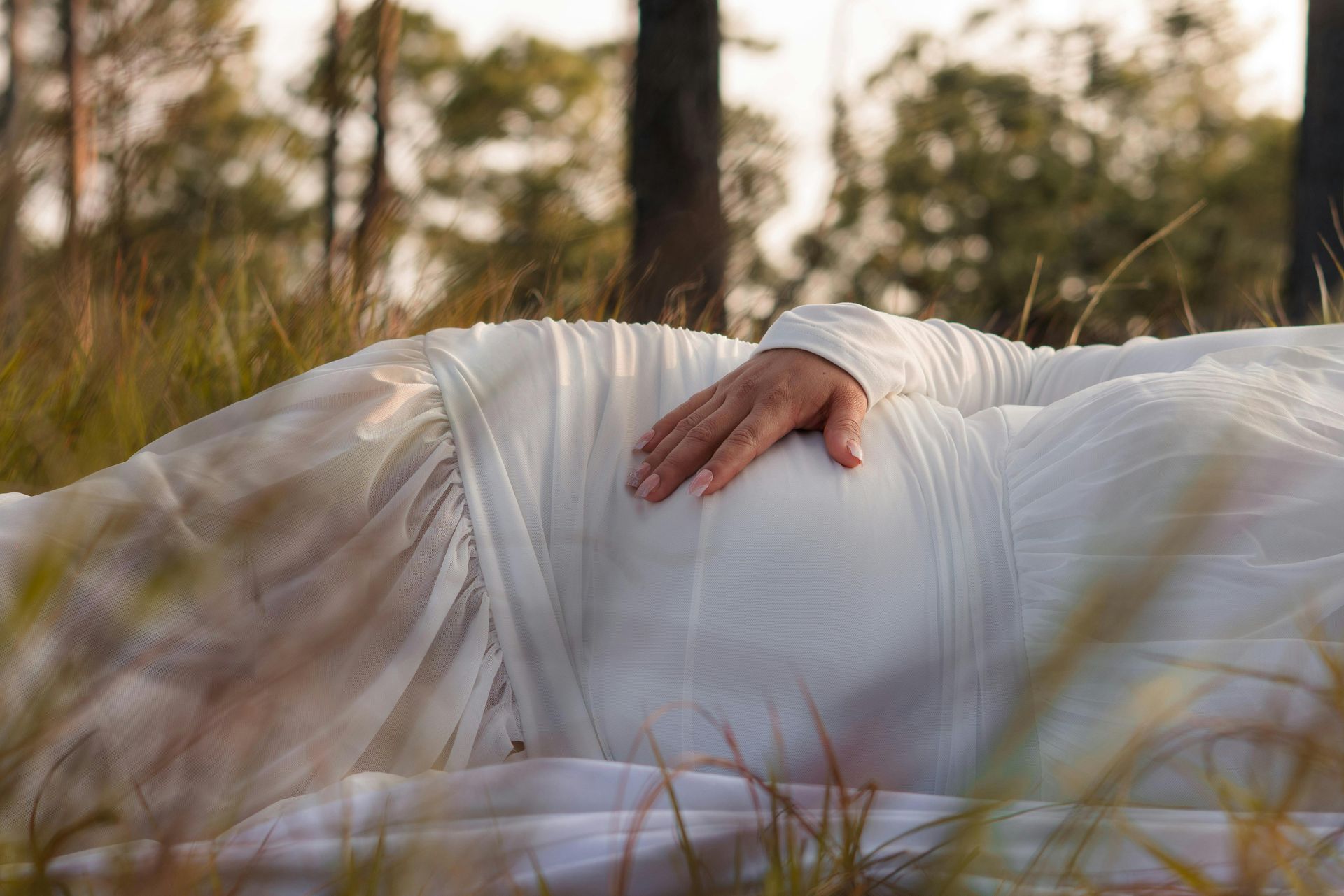 Pregnant Woman Lying in Field in Lakewood, OH