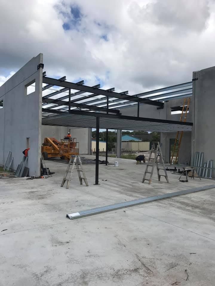 A Building Under Construction With A Metal Roof — Primmer Steel In Taree, NSW