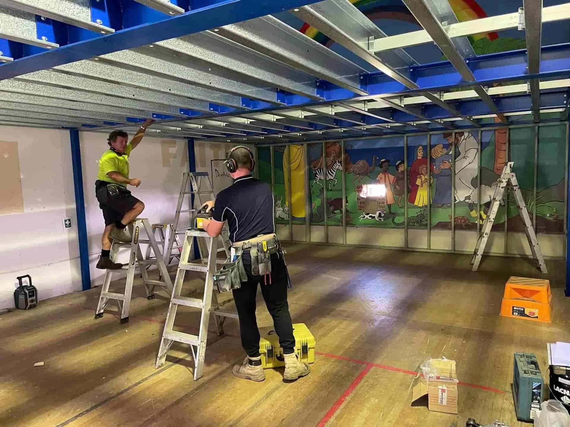 A Pile Of Metal Pieces Sitting On Top Of Wooden Pallets — Primmer Steel In Port Macquarie, NSW
