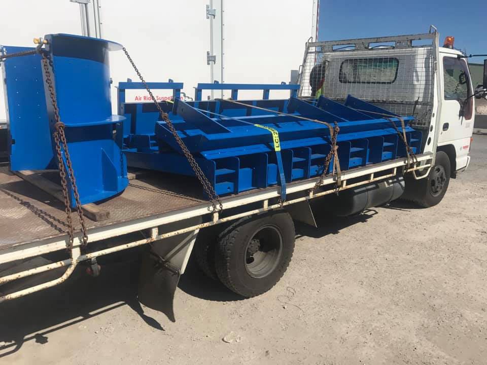 A Blue Truck Is Sitting On Top Of A Dirt Road — Primmer Steel In Nabiac, NSW