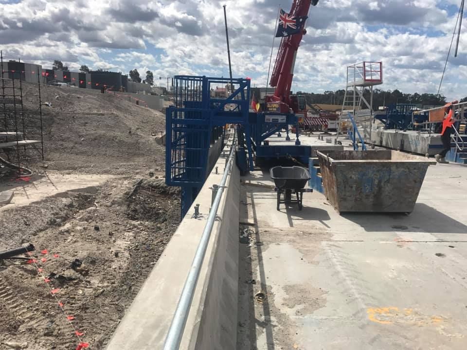 A Construction Site With A Crane And A Wheelbarrow — Primmer Steel In Nabiac, NSW