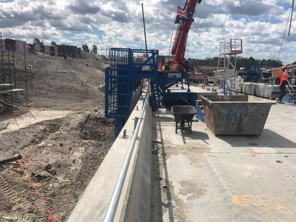 A Construction Site With A Crane And A Wheelbarrow — Primmer Steel In Nabiac, NSW