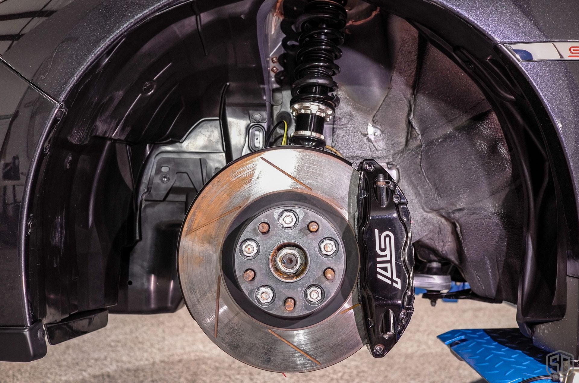 2010 Subaru WRX STI Signature Suspension Detail - wheels, suspension, and brake calipers close up Florida USA