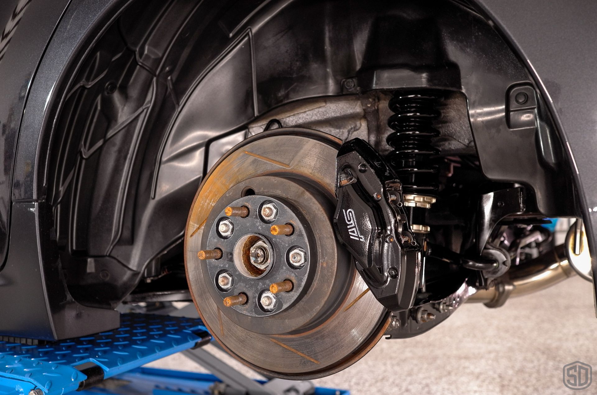 2010 Subaru WRX STI Signature Suspension Detail - wheels, suspension, and brake calipers close up OrlandoFlorida