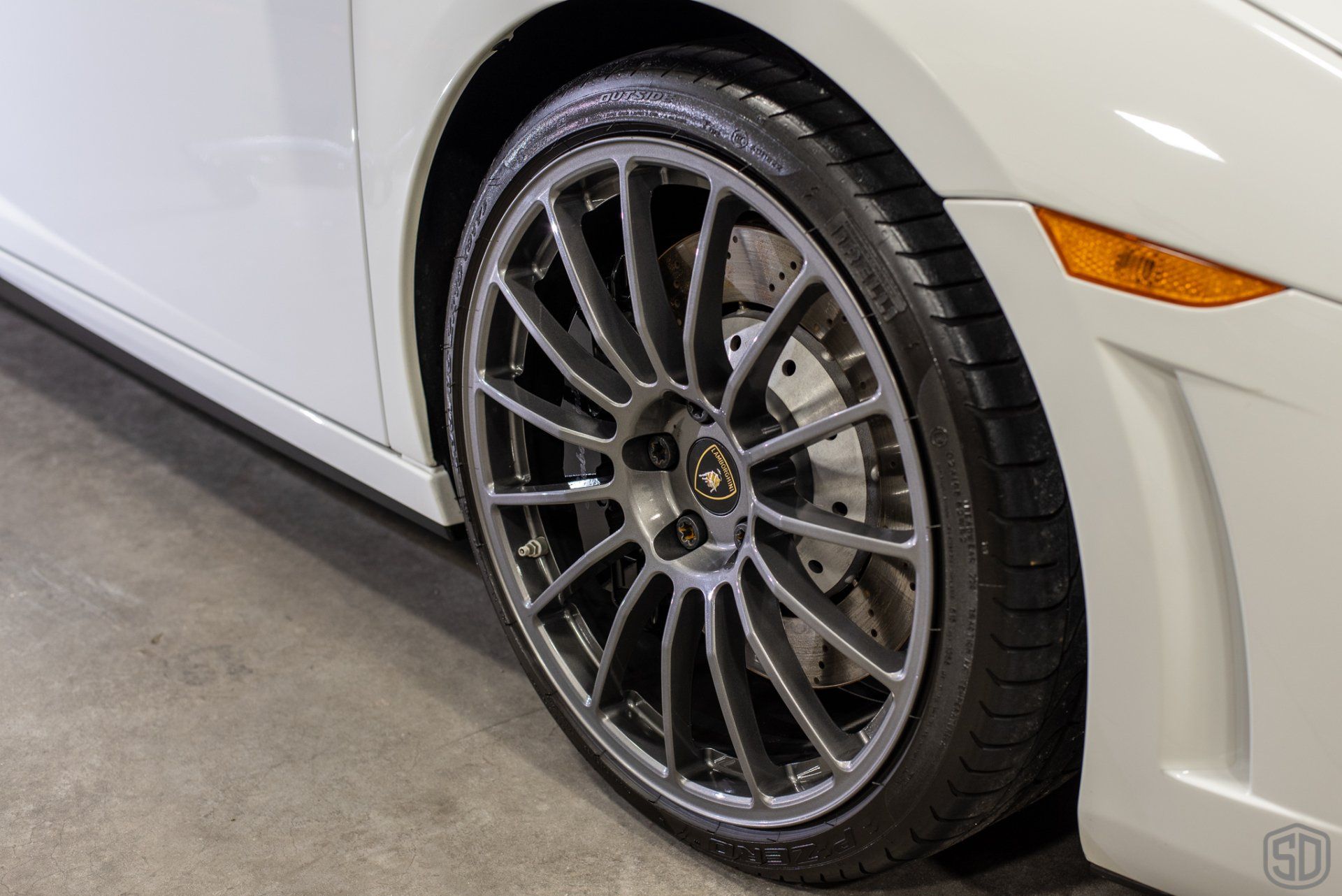 A close up of a car wheel with a tire on it.