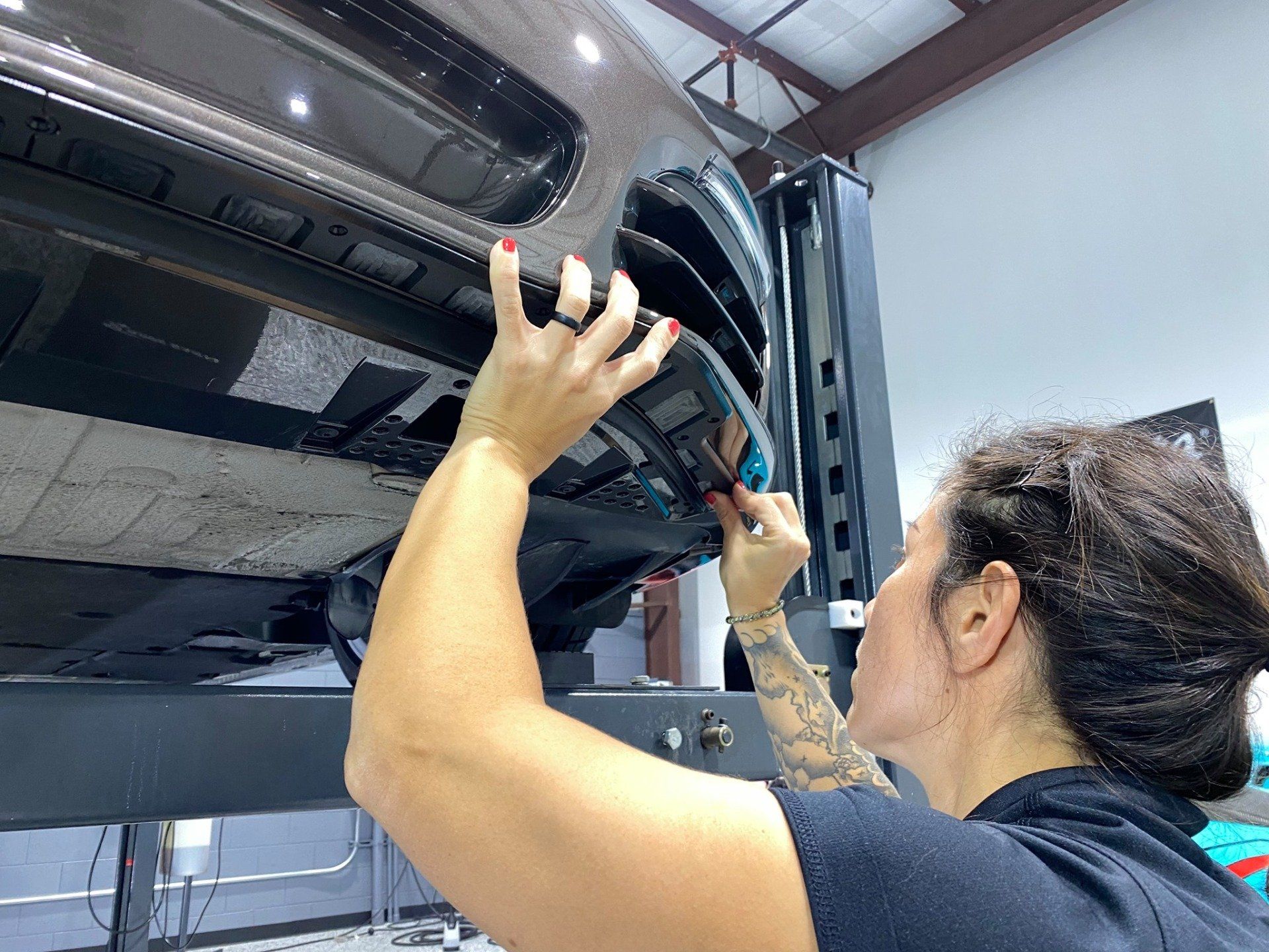 Kim installing scrape armor on 2013 Porsche Boxster S