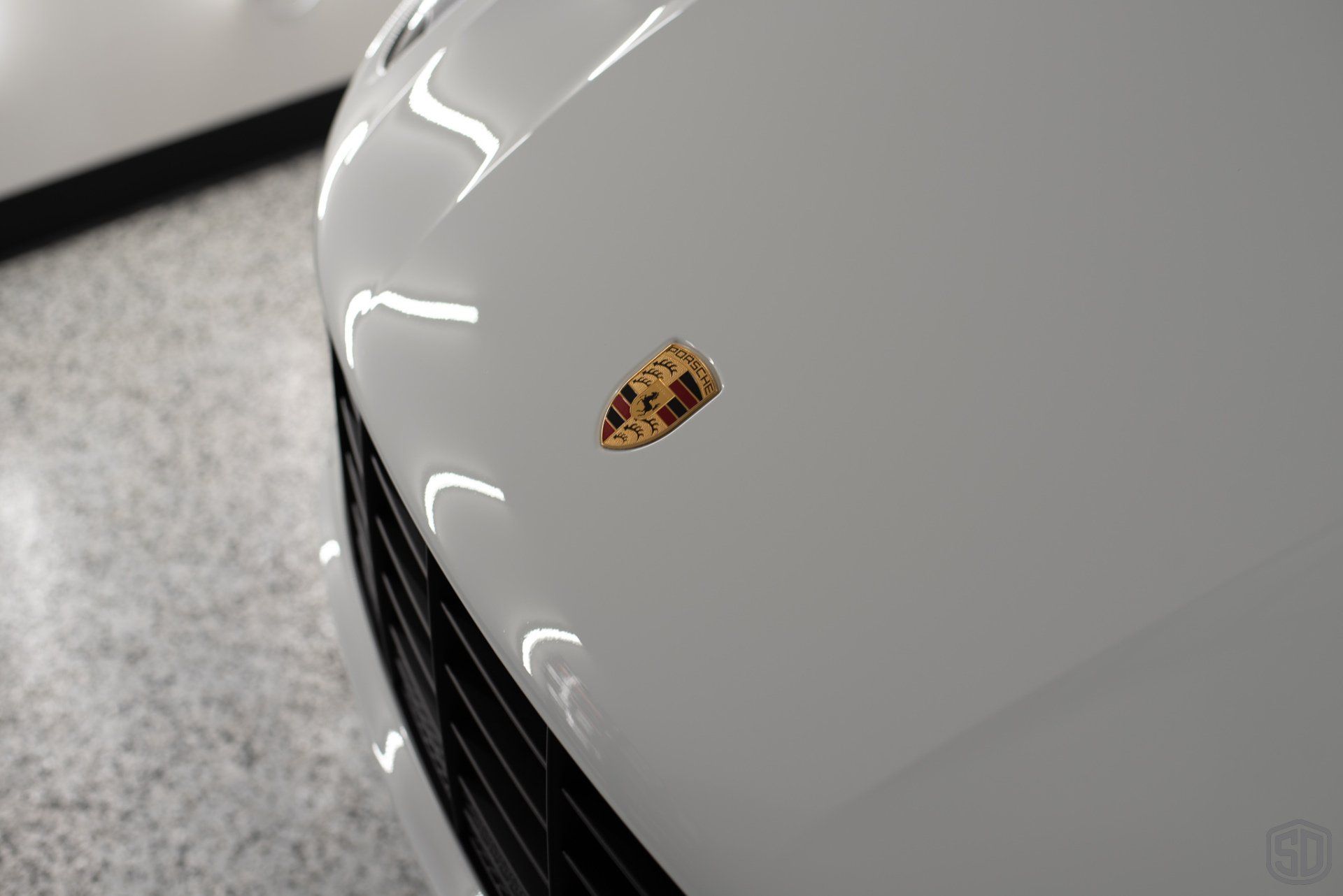 2019 Porsche Macan high end detailing Modesta BC-06 water repellent glass coating front hood emblem close up  Orlando Florida