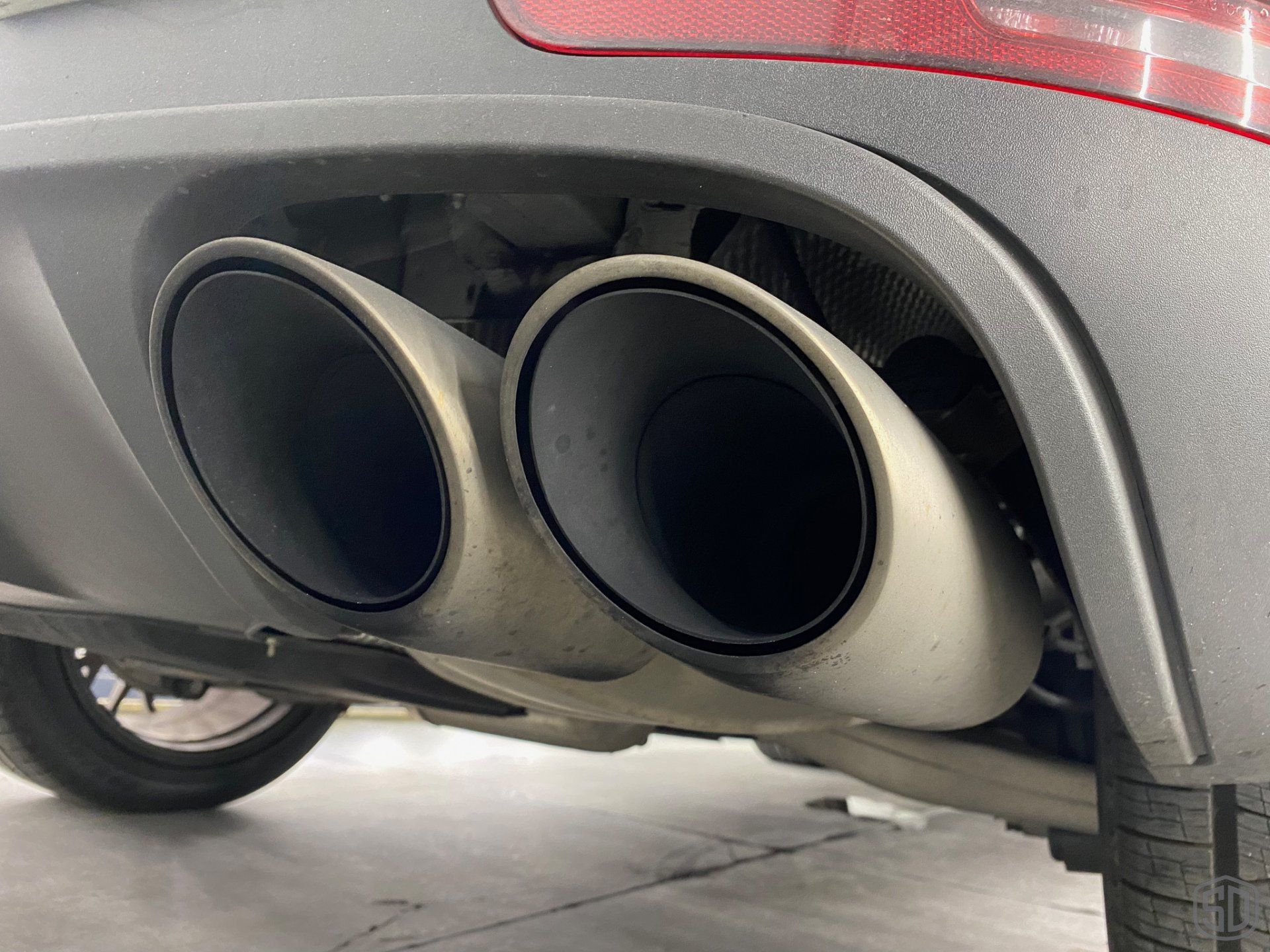 2019 Porsche Macan high end detailing Modesta BC-06 water repellent glass coating exhaust pipe close up Orlando Florida