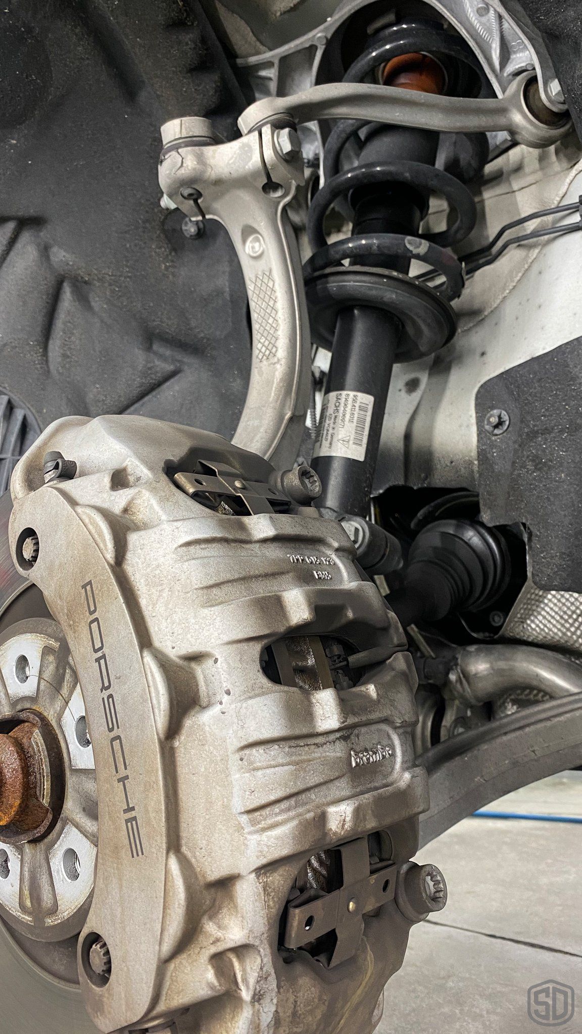 2019 Porsche Macan high end detailing Modesta BC-06 water repellent glass coating and Modesta Heat resistant coating for wheels and calipers close up Orlando Florida