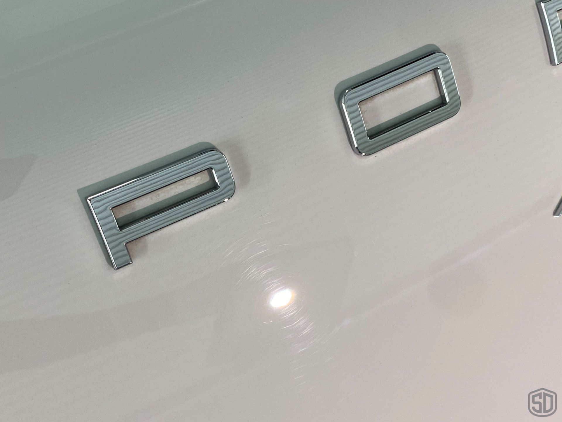 2019 Porsche Macan high end detailing Modesta BC-06 water repellent glass coating rear emblem close up Orlando Florida