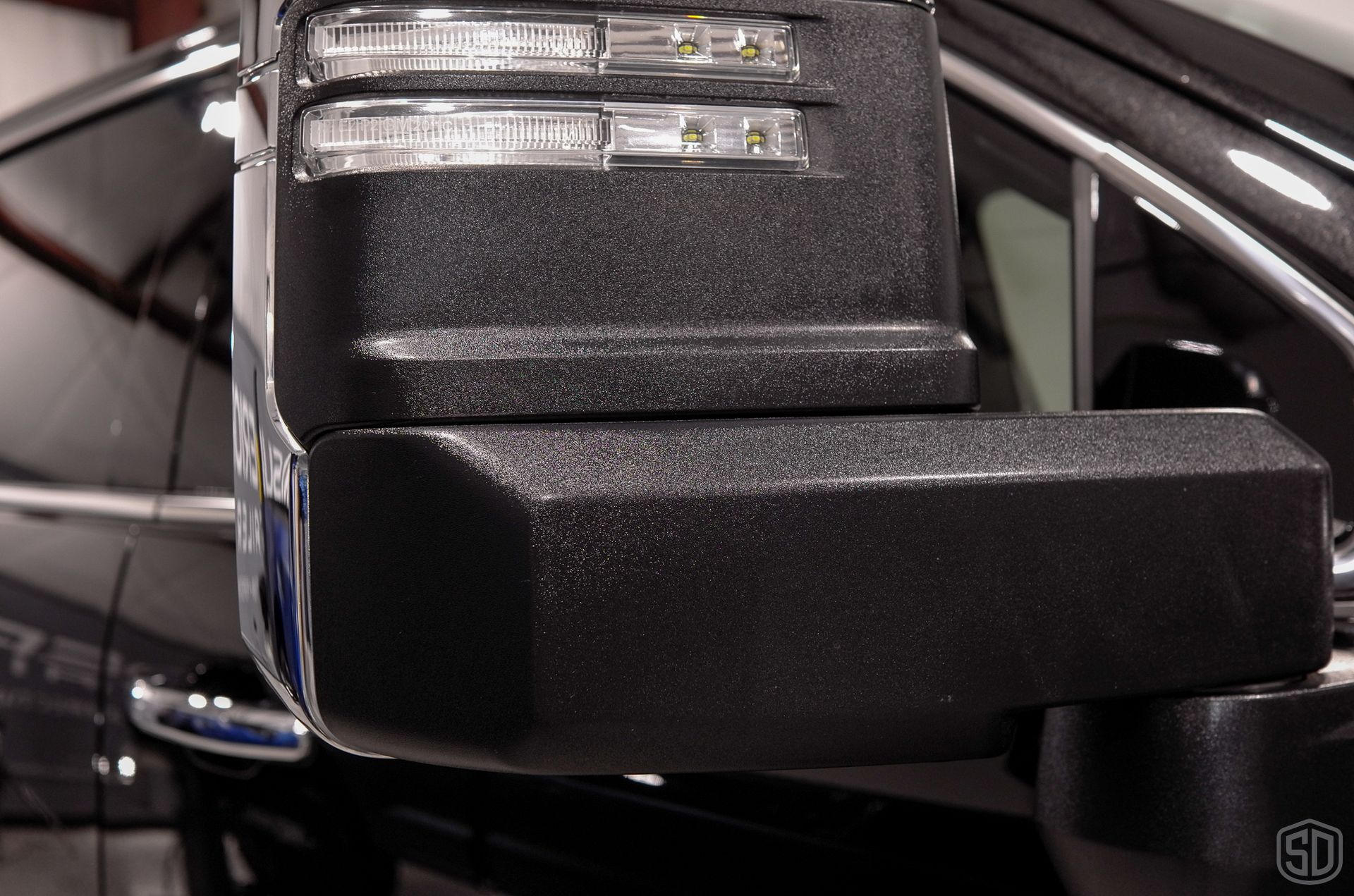 A close up of a side view mirror on a car