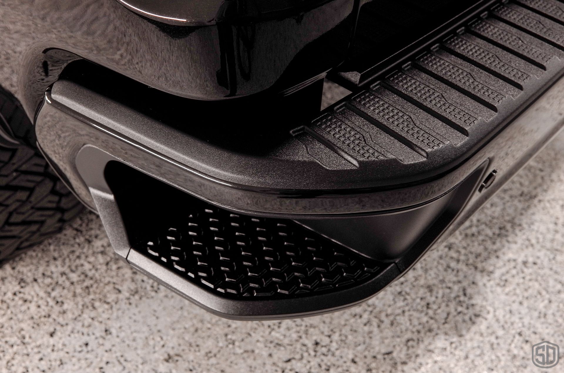 A close up of the rear bumper of a black truck