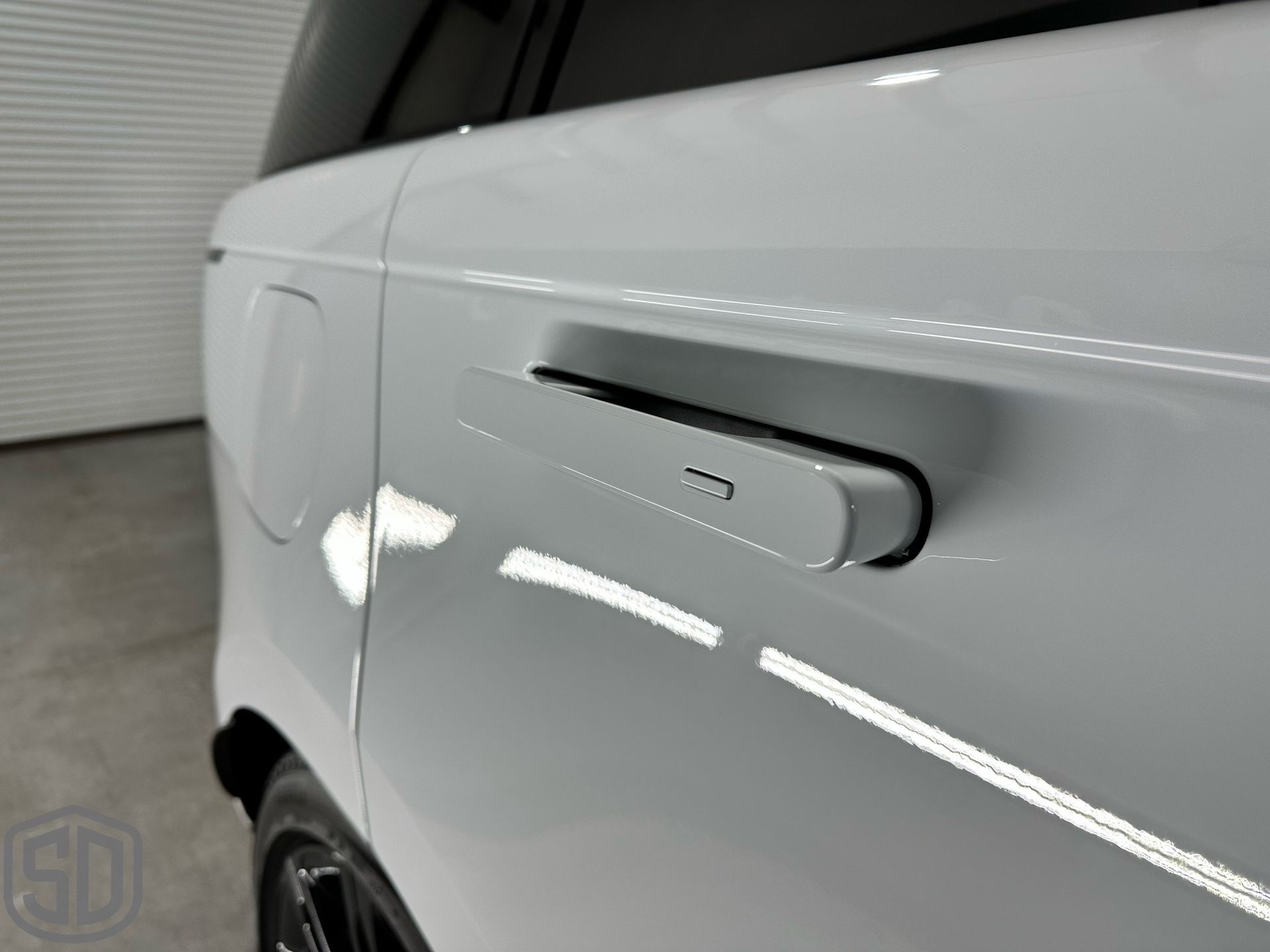 2023 Land Rover Range Rover Autobiography Detailing, Suntek Paint Protection Film, Ceramic Window Film, Modesta BC-06 Top Coat, Exterior Glass Coating, and BC-04 Nano-Titanium Coating door handle close up Orlando, FL
