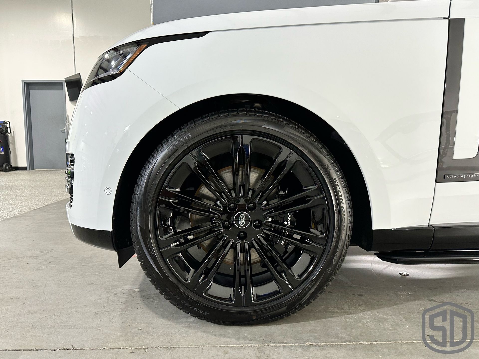 2023 Land Rover Range Rover Autobiography Detailing, Suntek Paint Protection Film, Ceramic Window Film, Modesta BC-06 Top Coat, Exterior Glass Coating, and BC-04 Nano-Titanium Coating front tire close up Orlando, FL