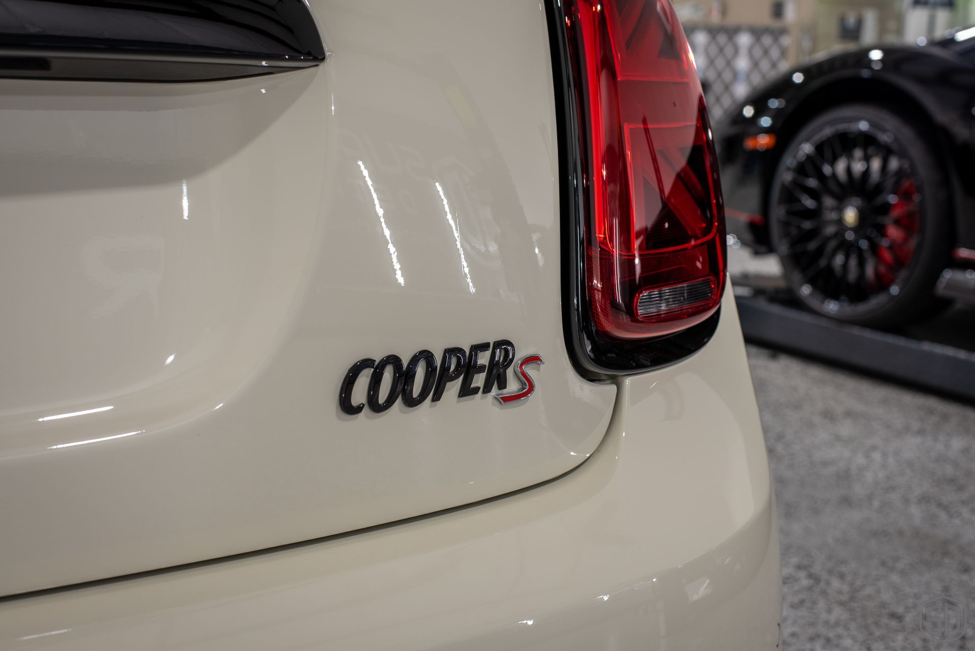 2023 MINI Cooper S Convertible New Car Protection Service Modesta exterior detail, paint correction, paint protection film, Modesta Leather Protection System rear emblem close up Orlando, Florida