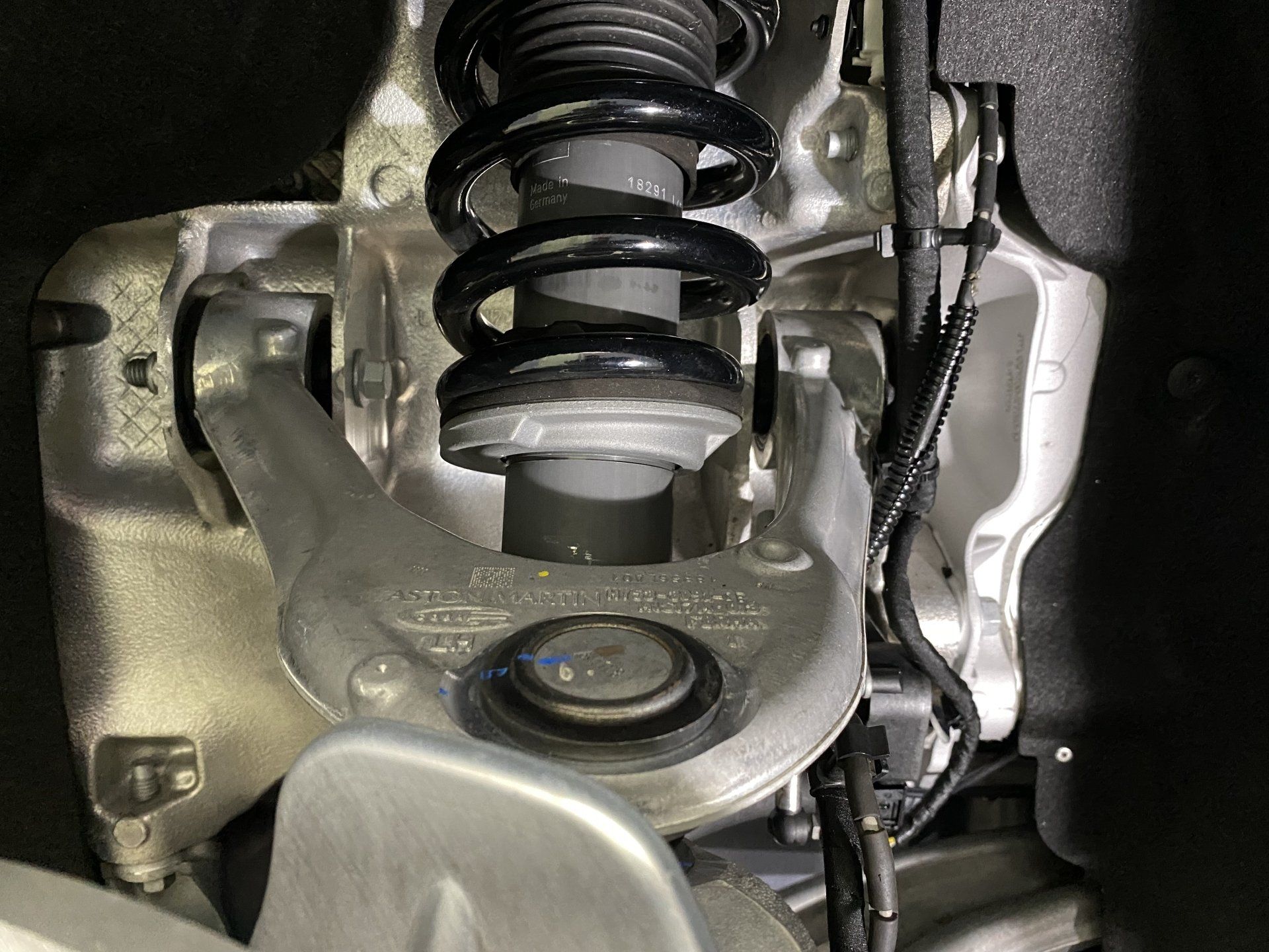 A close up of a shock absorber on a car.