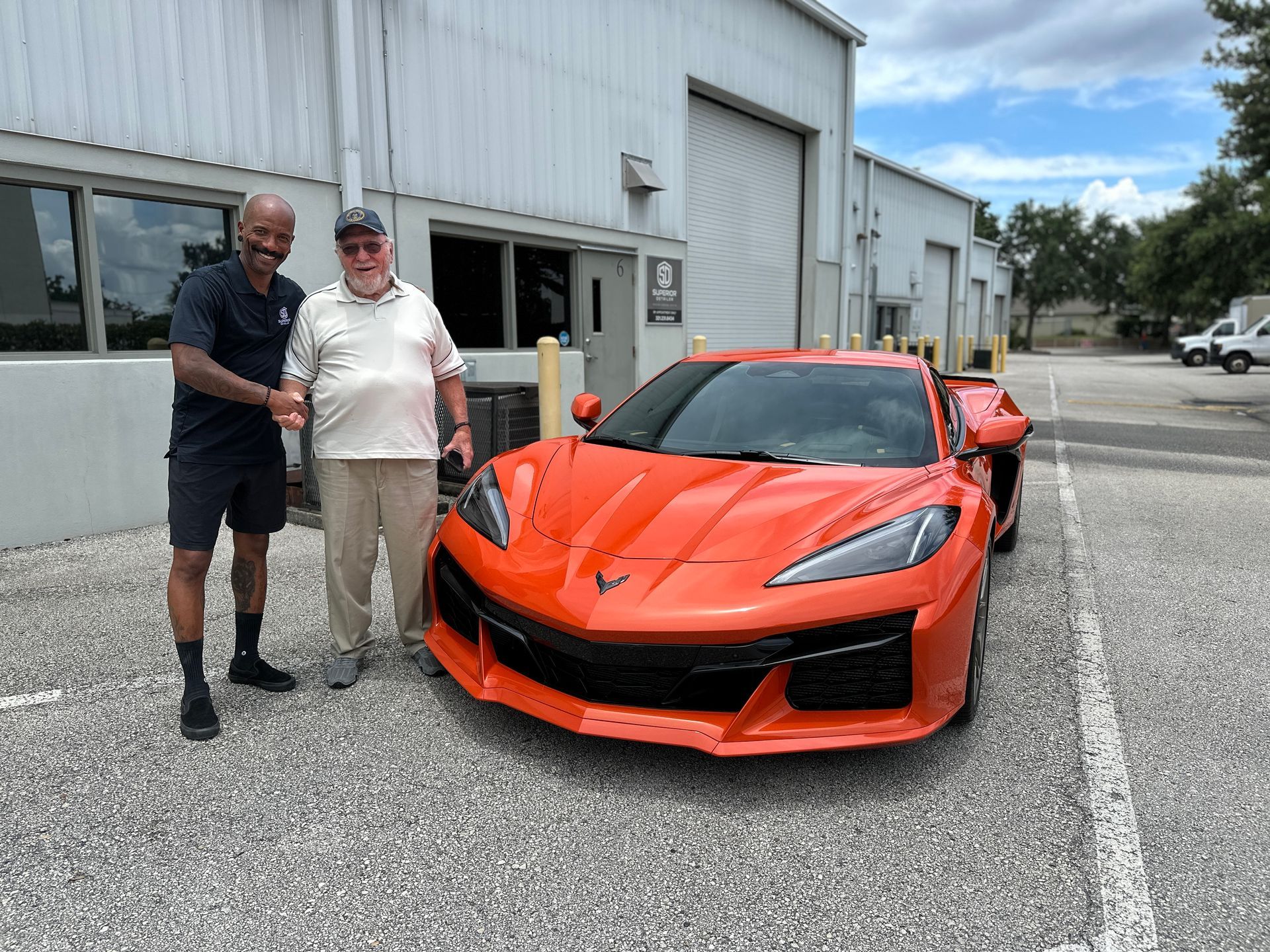 Karim smiling & shaking hands with our happy client!