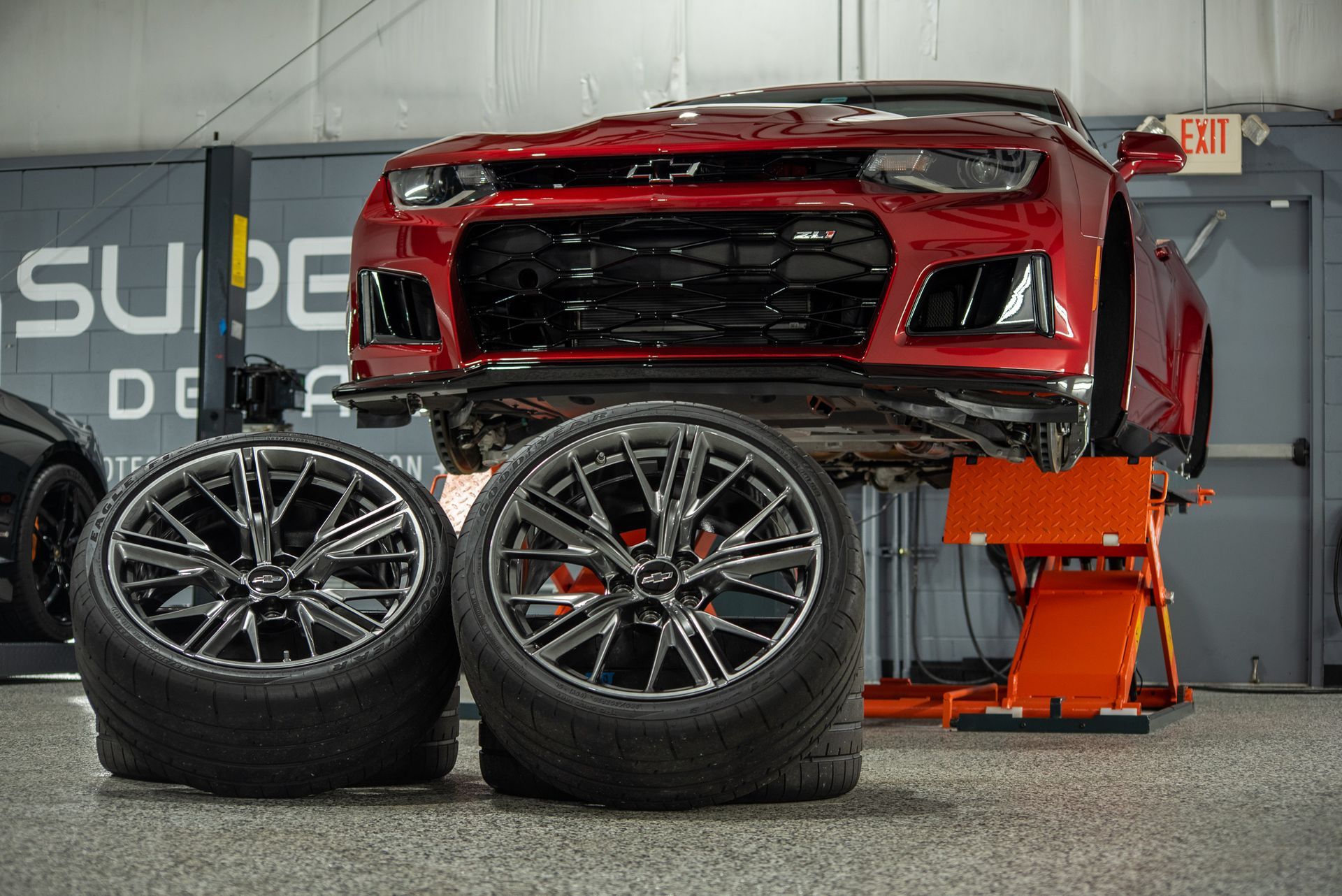 Chevrolet Camaro ZL1 Modesta Ceramic Coating on paint, wheels, and brake calipers and Xpel Paint Protection Film to Front Bumper and Rear Splash wheels off close up Orlando