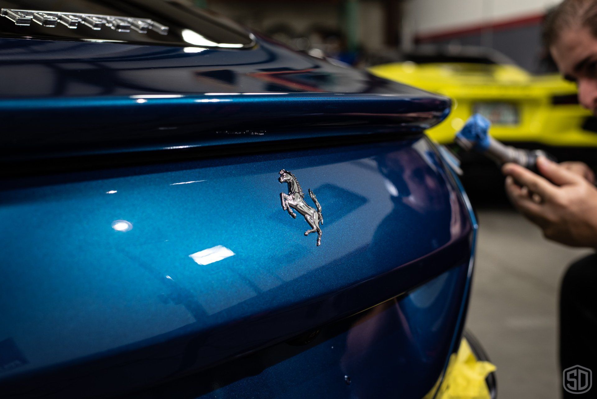 Ferrari Roma Detailing, Paint Correction, Modesta P0-1a Primer, Paint Protection Film, Leather Protection System, Modesta Wheel Coating and Glass Coating emblem close up Orlando USA