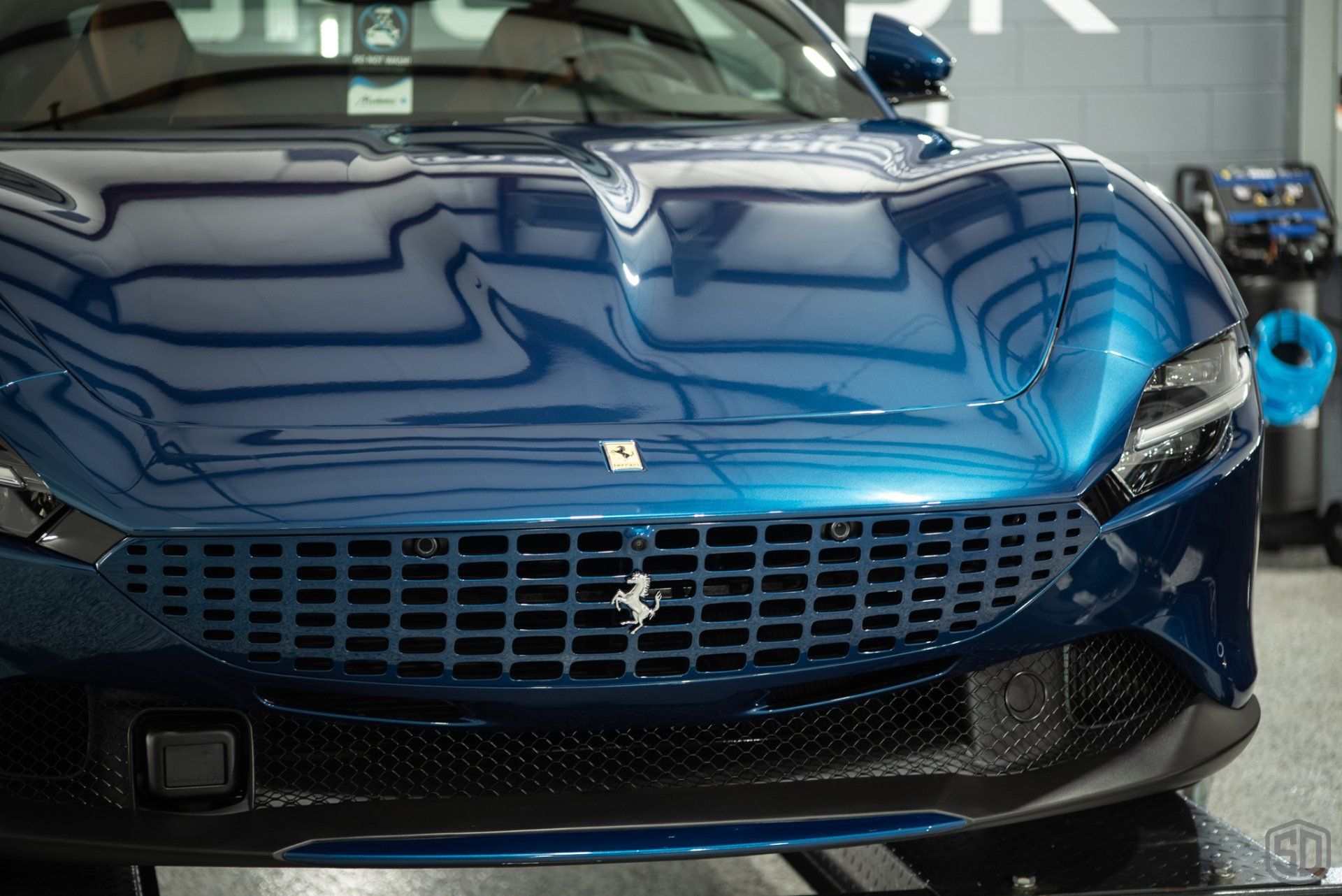 Ferrari Roma Detailing, Paint Correction, Modesta P0-1a Primer, Paint Protection Film, Leather Protection System, Modesta Wheel Coating and Glass Coating front grill close up Florida Orlando