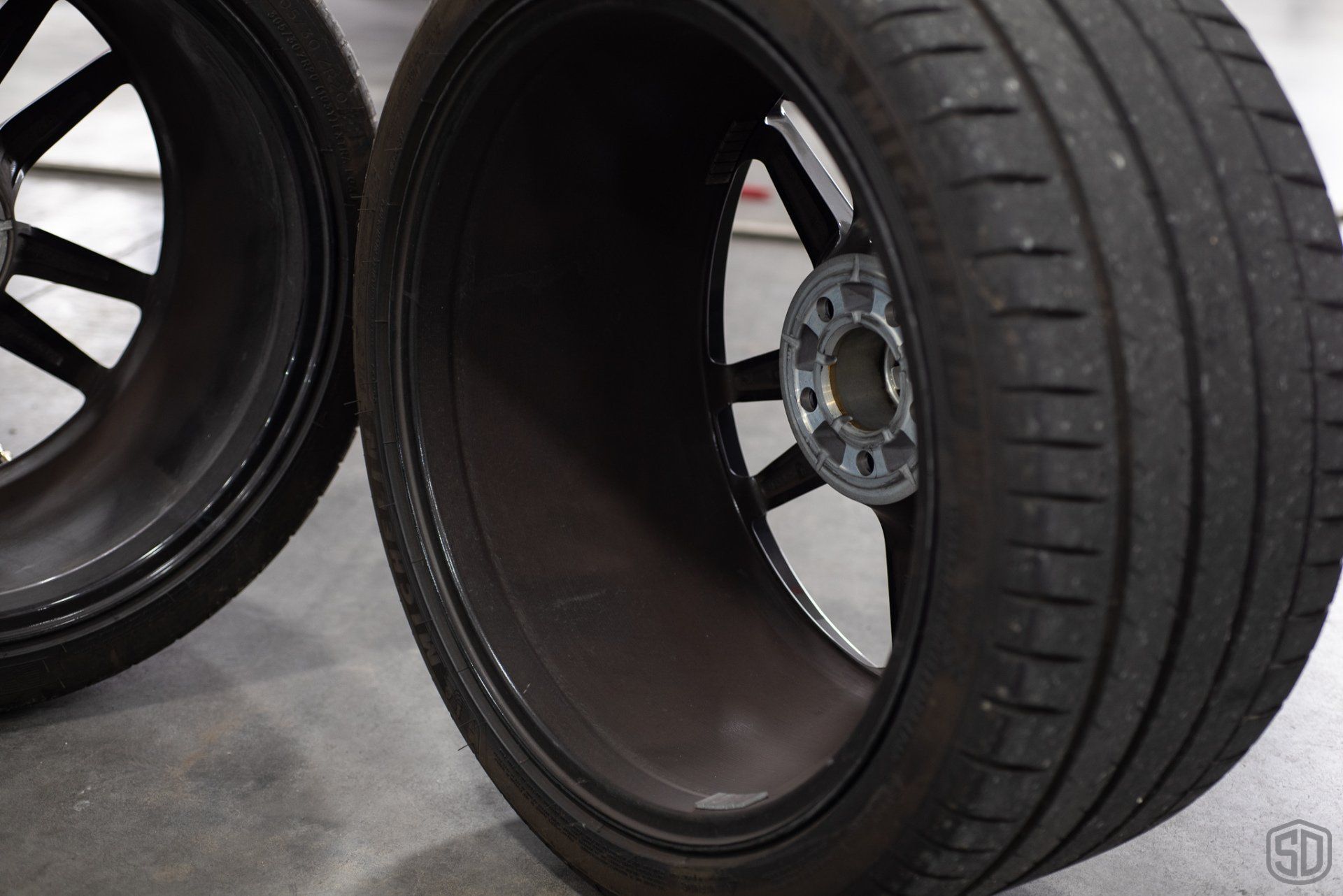 A close up of a tire on a car wheel