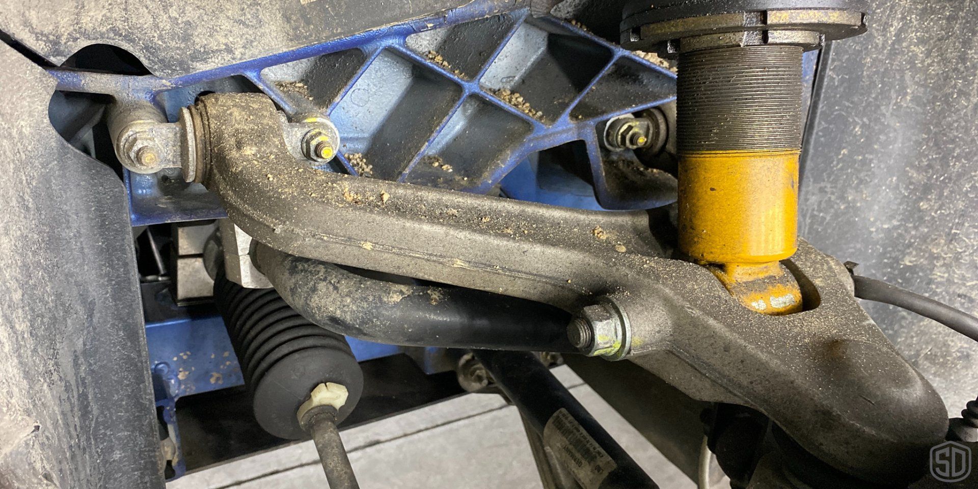 A close up of a suspension system on a car.