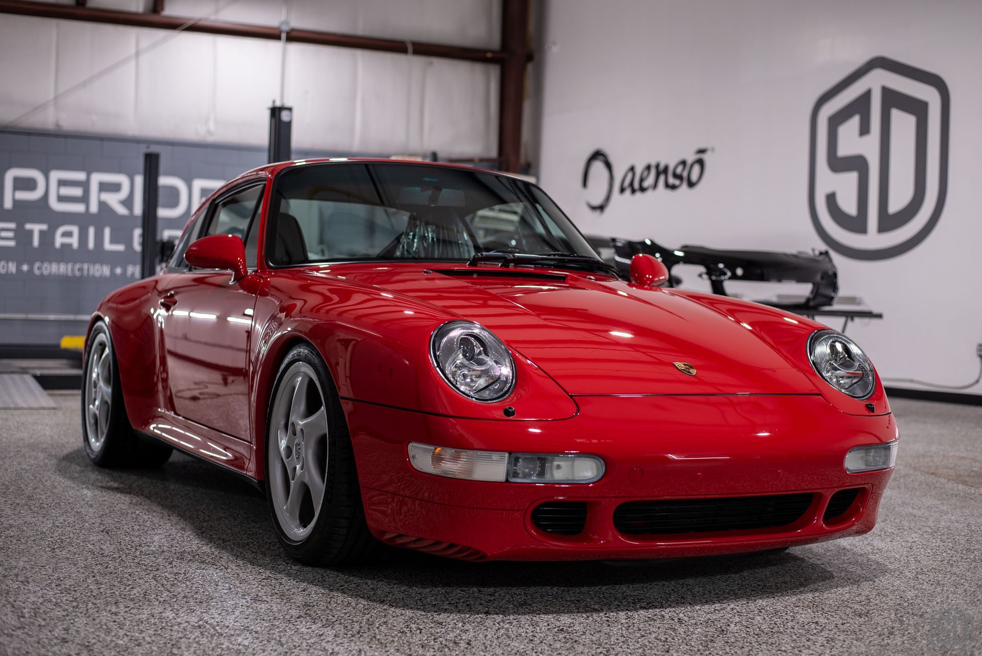 Red Porsche 911 in a garage