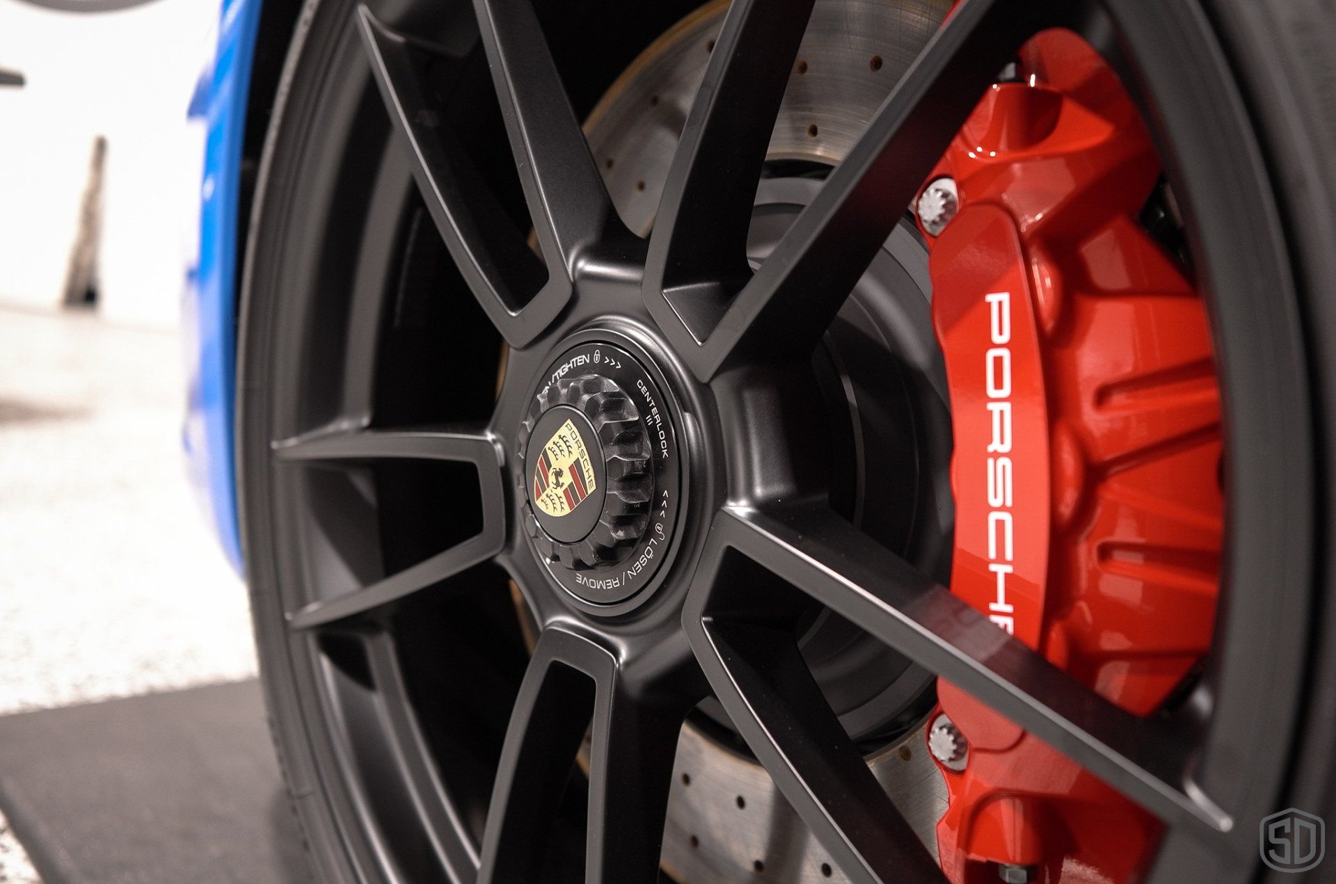 Shark Blue Porsche 911 Carrera GTS Detailing, Paint Correction, Paint Protection Film, Aenso Gleam Spray Sealant wheel and caliper close up Orlando, Florida