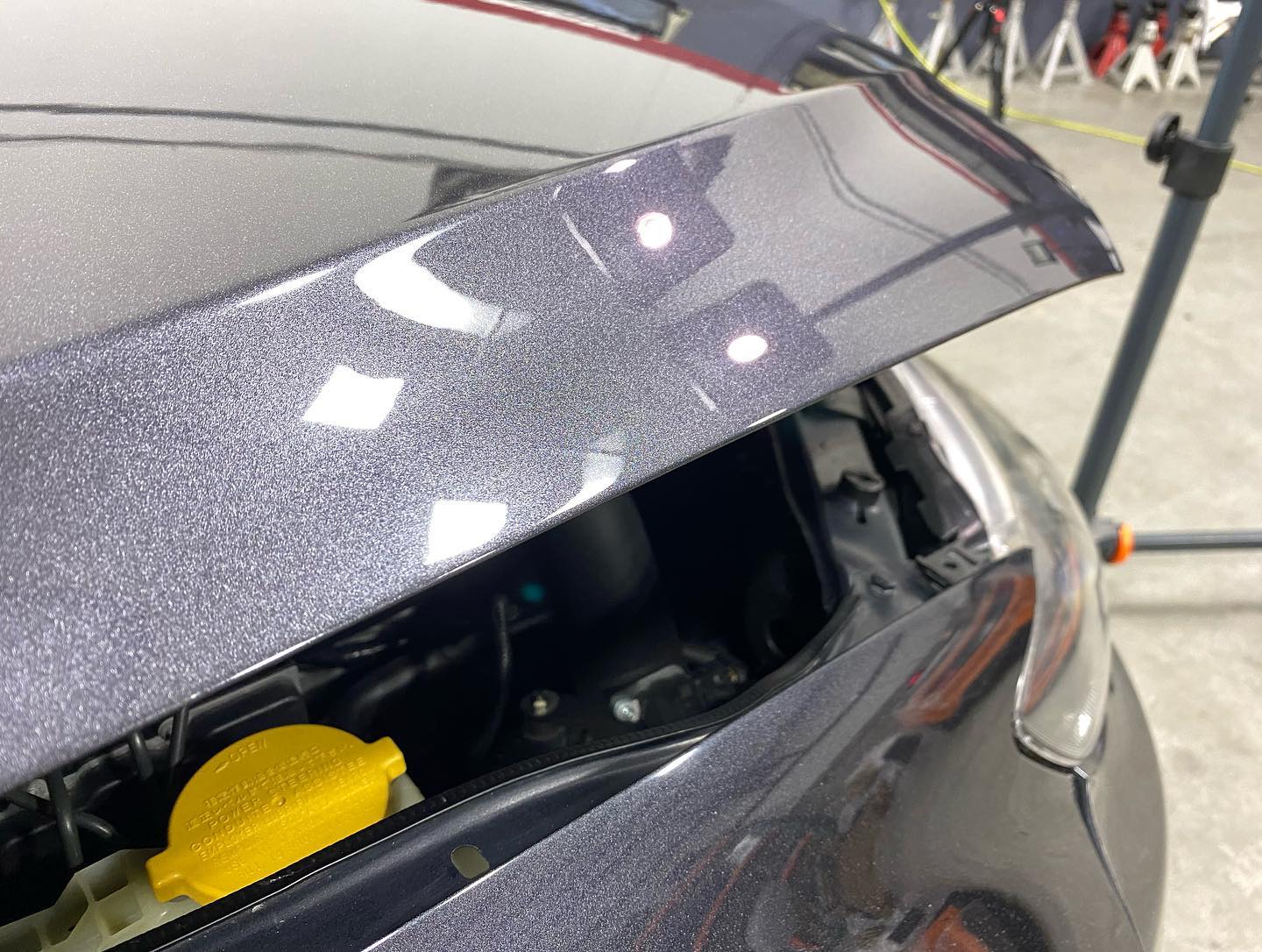 A close up of a car with the hood open