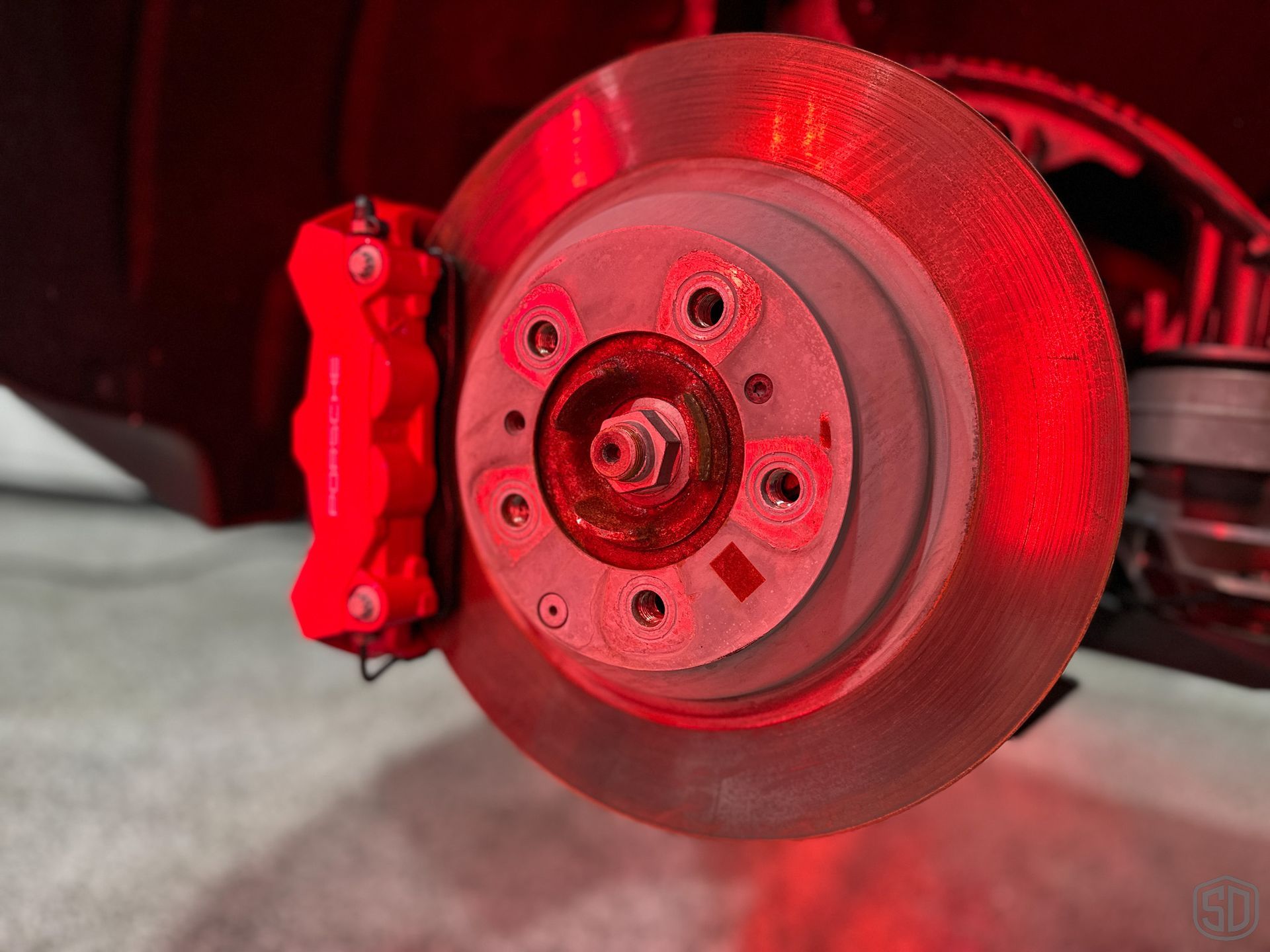 A close up of Modesta BC-06 being cured to break calipers via IR lamps