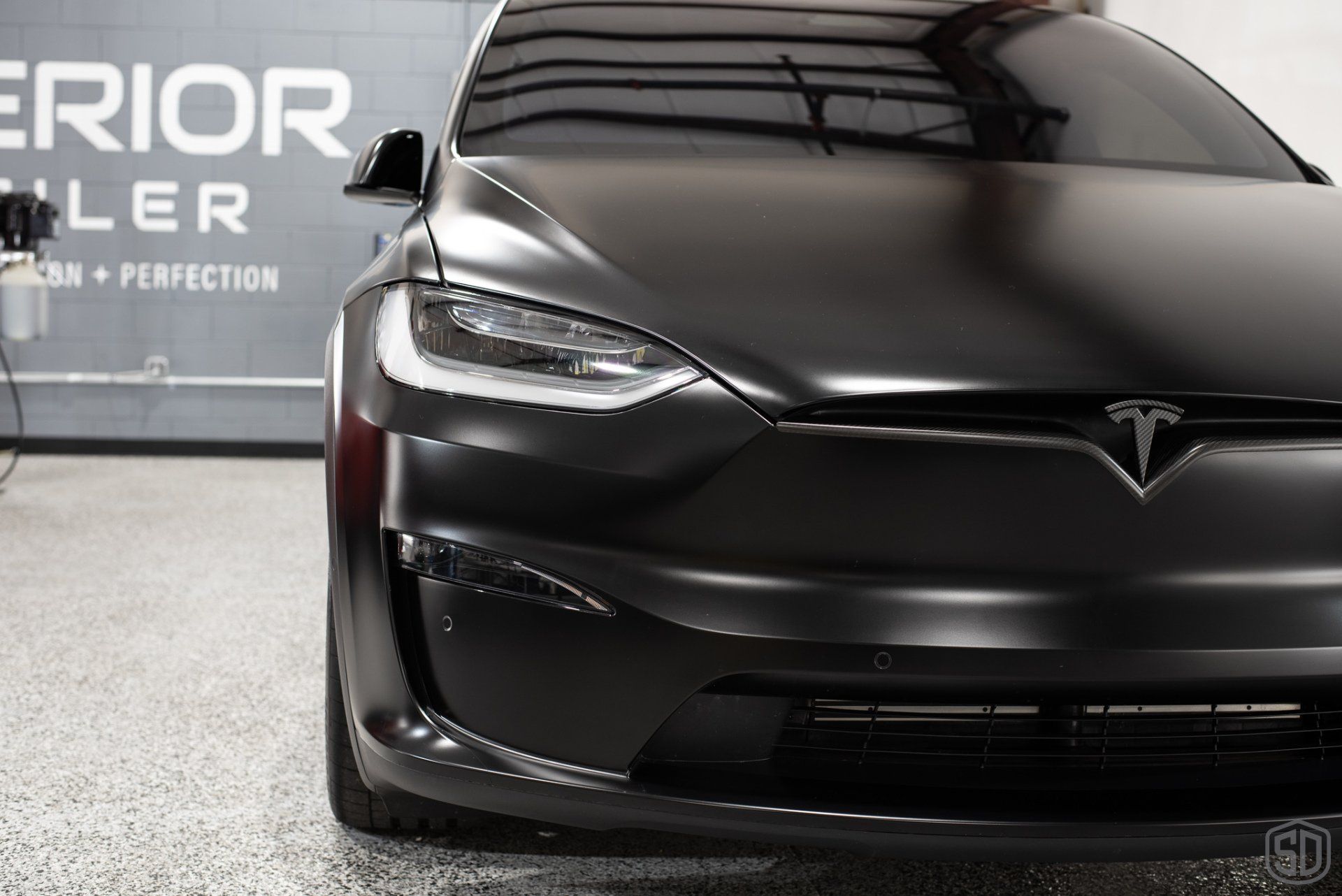 Tesla Model X Plaid Paint Correction Paint Protection Film Modesta Ceramic Glass Coating, Modesta Leather and Wheel Protection front close up view Orlando FL