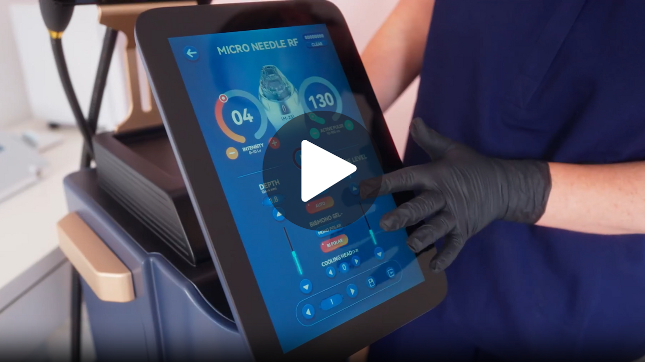 A person wearing black gloves is holding a tablet with a play button on it.