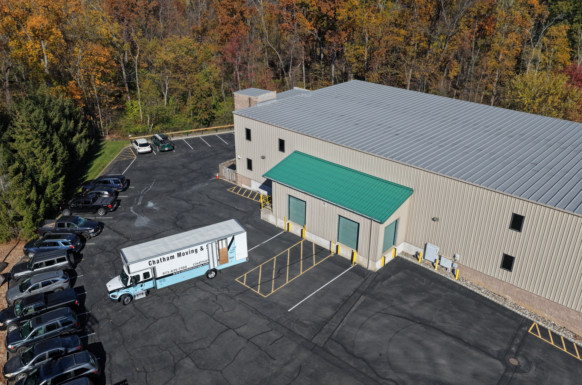 Exterior view of Climate Control Corporation building. Stone facade, green awning, sign: NJ Small Business of the Year.