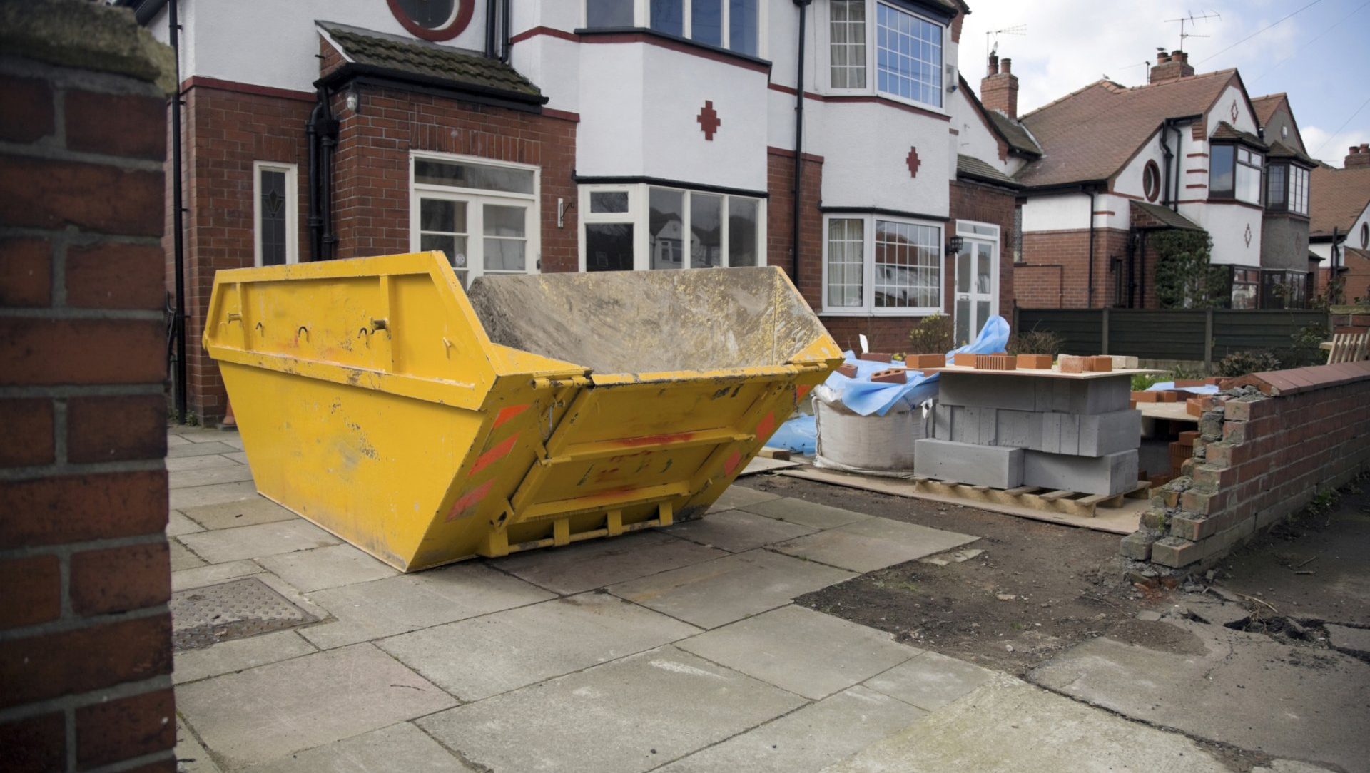 yellow skip on driveway