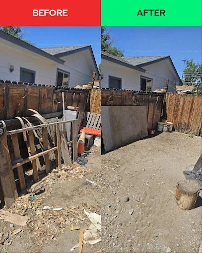 A dark gray pickup truck with a trailer parked in a parking lot on a sunny day.