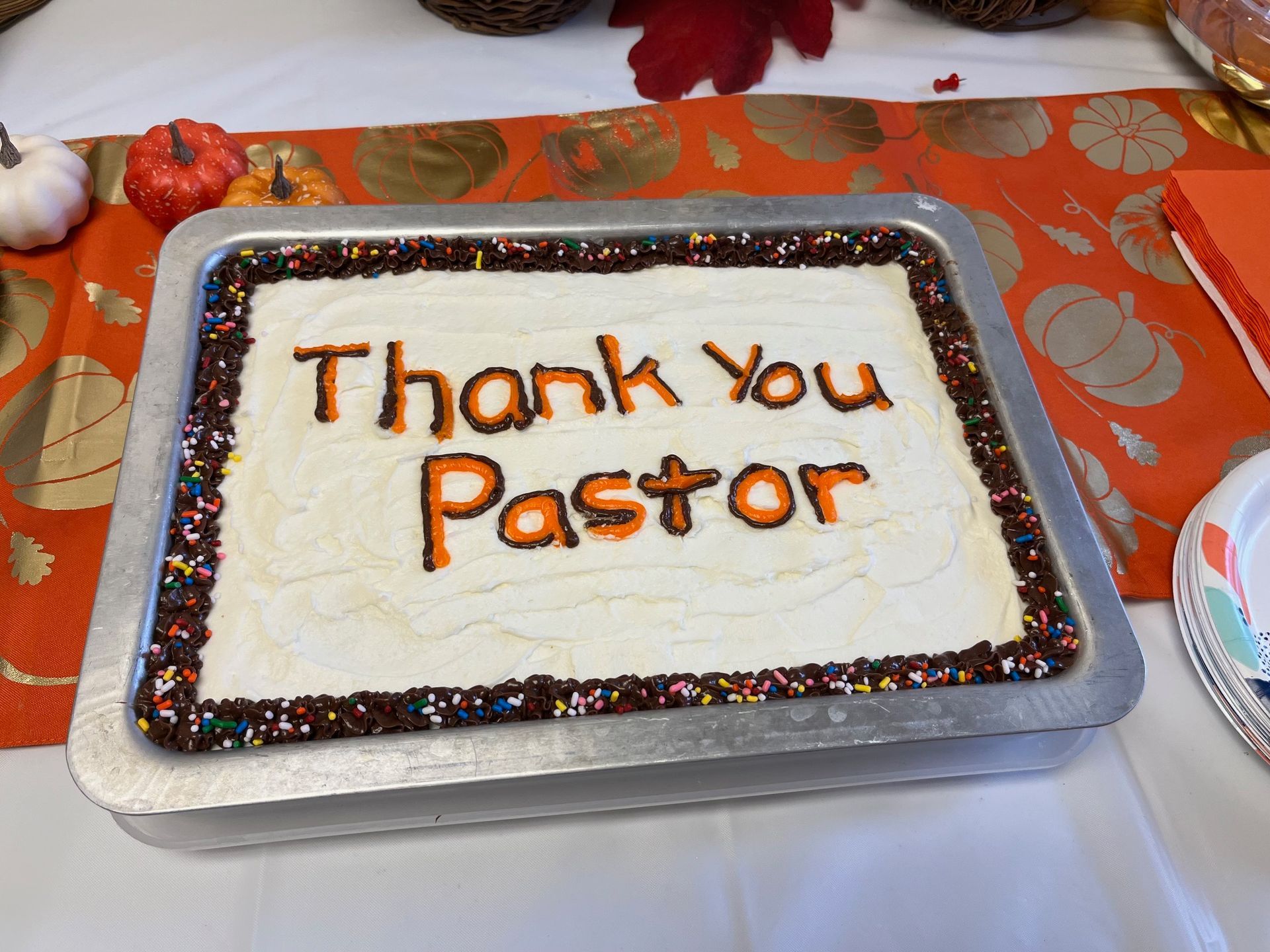 A cake with the words thank you pastor written on it