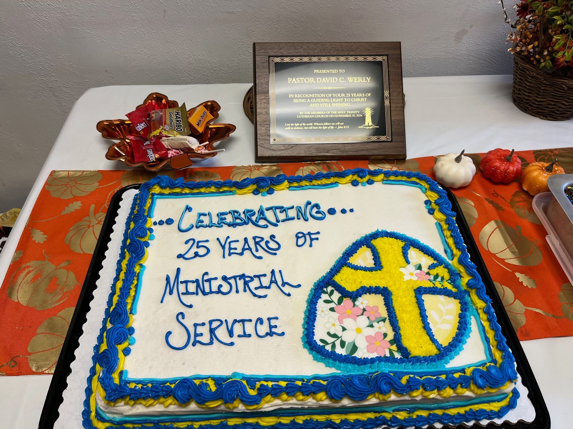 A cake that says celebrating 25 years of monasterial service