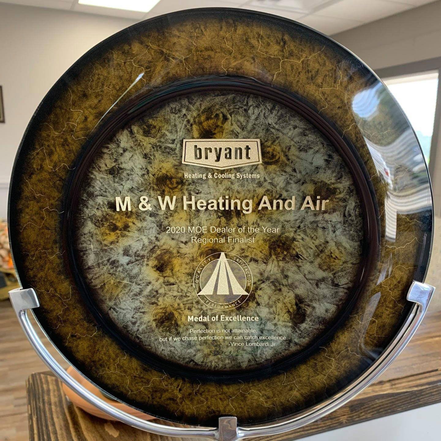 Plaque for M & W Heating and Air, a Bryant dealer. Text says